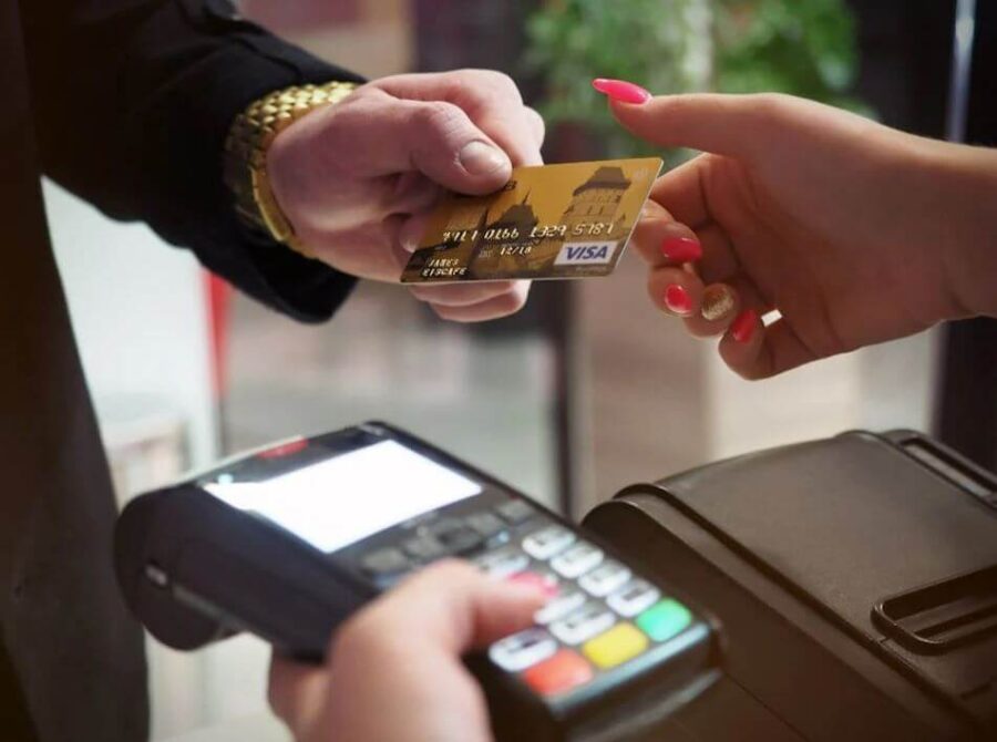 A happy traveler using a smartphone to find discounts for their travel to South Korea 2026.